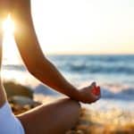 meditating woman while starting a personal retreat practicing mindfulness