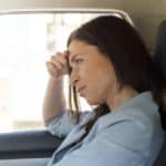 Angry and tense woman being stuck in the traffic
