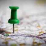 Thumbtack on a map symbol of where to go on retreat