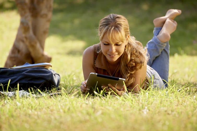 Woman with books and ipad doing a personal retreat