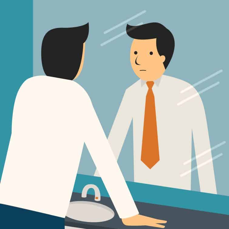 Businessman looking at himself in mirror to encourage and find himself confident. Trying to find your purpose